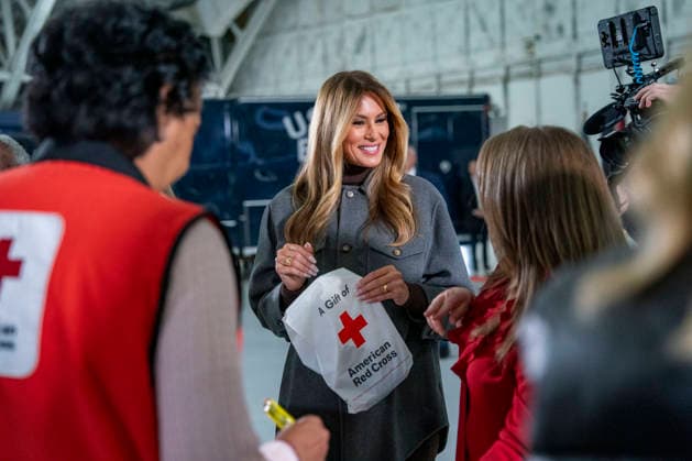 First Lady Melania Trump(C), creates care packages for deployed Service members with volunteers with the American Red Cross, U.S. Government Cabinet spouses, military spouses an Second Lady Usha Vance at Joint Base Andrews in Prince Georges County, Maryland on Monday, December 1, 2025.  WAP20251201369 BONNIExCASH
