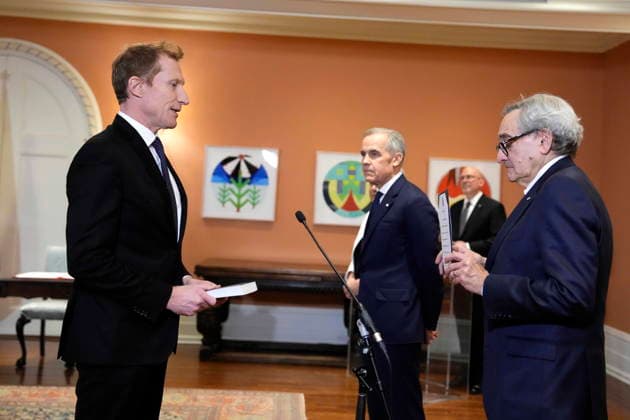December 1, 2025, Ottawa, On, CAN: Mark Miller is sworn in as Minister of Canadian Identity and Culture and Minister responsible for Official Languages as Prime Minister Mark Carney looks on, at a cabinet swearing in ceremony at Rideau Hall in Ottawa, on Monday, Dec. 1, 2025. Ottawa CAN  - ZUMAc35_ 20251201_zaf_c35_030 Copyright: xJustinxTangx