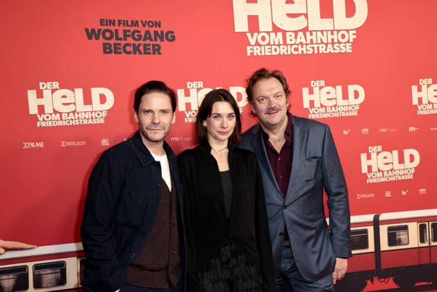 Daniel Bruehl, Christiane Paul and Charly Huebner at the öDer Held vom Bahnhof Friedrichstrasse cinema premiere on 2 12 2025 at the Delphi Filmpalast in Berlin Der Held vom Bahnhof Friedrichstrasse film premiere in Berlin