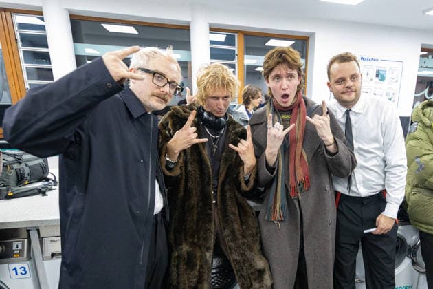 Kraftklub give a surprise concert in Bonn launderette 02 12 25 Steffen ISRAEL on the left and Till BRUMMER on the right taking a selfie with fans The band Kraftklub played a spontaneous acoustic set in the Eco Express launderette in Fran Copyright: xBonn.digitalx