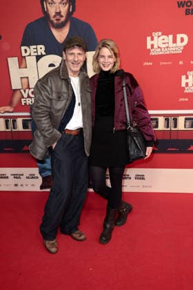 Hendrik Duryn and Rike Schmid at the Der Held vom Bahnhof Friedrichstrasse cinema premiere on 2 12 2025 at the Delphi Filmpalast in Berlin Der Held vom Bahnhof Friedrichstrasse film premiere in Berlin