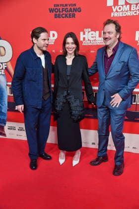 Daniel Brühl, Christiane Paul and Charly Hübner at the premiere of DER HELD VOM BAHNHOF FRIEDRICHSTRASSE at the Delphi Filmpalast in Berlin 02 12 2025