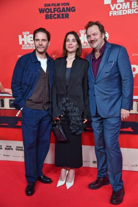 Daniel Brühl, Christiane Paul and Charly Hübner at the premiere of DER HELD VOM BAHNHOF FRIEDRICHSTRASSE at the Delphi Filmpalast in Berlin 02 12 2025