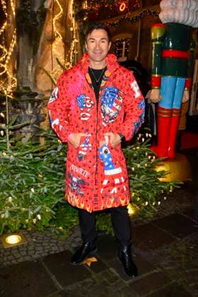 ABBkoeln Lucas Cordalis German singer wears a red colored coat as a guest at Katys X Mas Wonderland Christmas Party at Wolkenburg on 02 12 2025 in Cologne NRW Germany