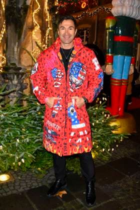 ABBkoeln Lucas Cordalis German singer wears a red colored coat as a guest at Katys X Mas Wonderland Christmas Party at Wolkenburg on 02 12 2025 in Cologne NRW Germany