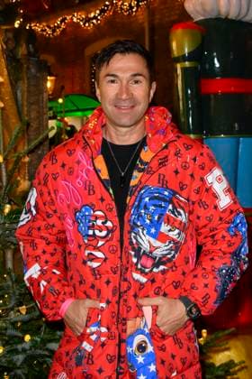 ABBkoeln Lucas Cordalis German singer wears a red colored coat as a guest at Katys X Mas Wonderland Christmas Party at Wolkenburg on 02 12 2025 in Cologne NRW Germany
