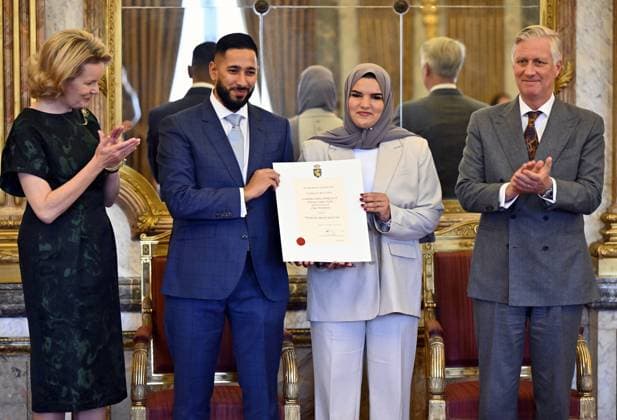 Queen Mathilde of Belgium, Sakina Boukyoue, Samir Fraihi of Claes Stroobants and King Philippe - Filip of Belgium pose for the photographer during a royal reception with the newly appointed suppliers holding a Royal warrant of appointment (Brevet van Hofleverancier - Brevet de Fournisseurs de la cour), at the Royal Palace, in Brussels, Wednesday 03 December 2025.  ERICxLALMAND 146115343