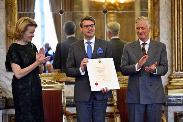 Queen Mathilde of Belgium, Queen Mathilde of Belgium, Gregory Hassid of Direct Way and King Philippe - Filip of Belgium pose for the photographer during a royal reception with the newly appointed suppliers holding a Royal warrant of appointment (Brevet van Hofleverancier - Brevet de Fournisseurs de la cour), at the Royal Palace, in Brussels, Wednesday 03 December 2025.  ERICxLALMAND 146116144