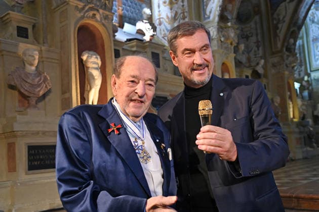 Ralph SIEGEL Composer presents Markus SOEDER State Premier of Bavaria and CSU Chairman with a golden microphone Bavarian Maximilian Order Award Ceremony on 03 12 2025 at the Antiquariat of the Residence in Munich