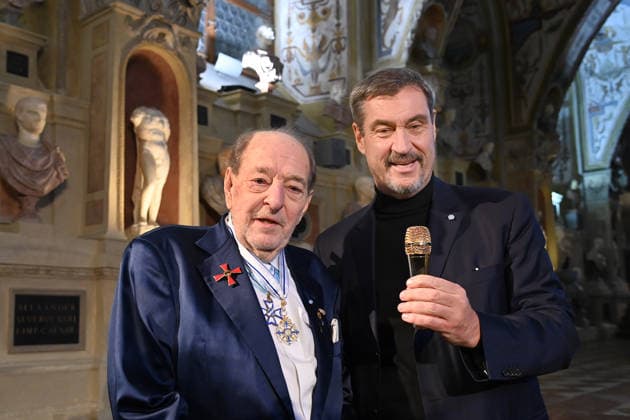 Ralph SIEGEL Composer presents Markus SOEDER State Premier of Bavaria and CSU Chairman with a golden microphone Bavarian Maximilian Order Award Ceremony on 03 12 2025 at the Antiquariat of the Residence in Munich
