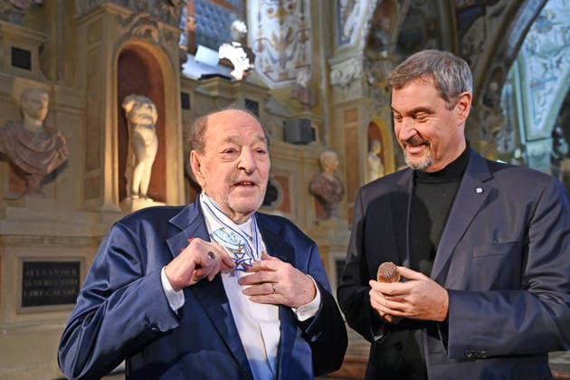 Ralph SIEGEL Composer presents Markus SOEDER State Premier of Bavaria and CSU Chairman with a golden microphone Bavarian Maximilian Order Award Ceremony on 03 12 2025 at the Antiquariat of the Residence in Munich