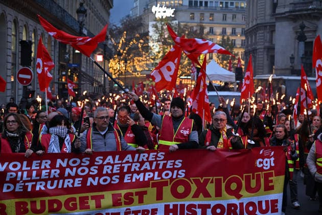 French CGT protest in Paris to maintain the social benefits PARIS, FRANCE - DECEMBER 03: Members of the French General Confederation of Labour (Confederation generale du travail, CGT) march with torchlight to protest against the austerity and inequality, calling for better work conditions and higher salaries in Paris, France on December 03, 2025. Mustafa Yalcin Anadolu Paris France. Editorial use only. Please get in touch for any other usage.  Copyright: x2025xAnadoluxMustafaxYalcinx
