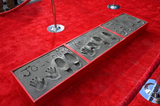 The Jonas Brothers hand and footprints are on display following a ceremony immortalizing the musicians in the forecourt of the TCL Chinese Theatre (formerly Grauman s) in the Hollywood section of Los Angeles on Wednesday, December 3, 2025.  LAP2025120324 JIMxRUYMEN