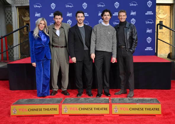 (L-R) Ellen K, Nick Jonas, Kevin Jonas and Joe Jonas of the Jonas Brothers, and Ryan Seacrest participate in a hand and footprint ceremony immortalizing the musicians in the forecourt of the TCL Chinese Theatre (formerly Grauman s) in the Hollywood section of Los Angeles on Wednesday, December 3, 2025.  LAP2025120328 JIMxRUYMEN