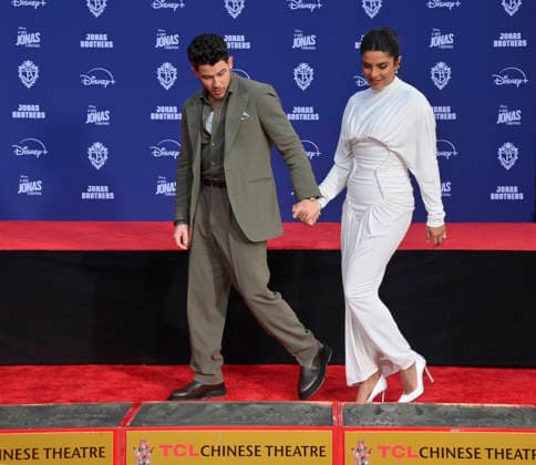 Nick Jonas is joined by his wife Priyanka Chopra at the Jonas Brothers hand and footprint ceremony immortalizing them in the forecourt of the TCL Chinese Theatre (formerly Grauman s) in the Hollywood section of Los Angeles on Wednesday, December 3, 2025.  LAP2025120318 JIMxRUYMEN