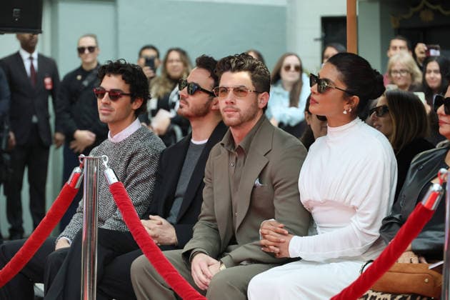 December 3, 2025, Los Angeles, California, USA: Joe Jonas, Kevin Jonas, Nick Jonas, Priyanka Chopra Jonas at a ceremony honoring the Jonas Brothers with hand and foot prints at the TCL Chinese Theatre IMAX. Los Angeles USA - ZUMAg107 20251203_zep_g107_007 Copyright: xNinaxPrommerx