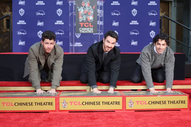 December 3, 2025, Los Angeles, California, USA: Nick Jonas, Kevin Jonas, Joe Jonas at a ceremony honoring the Jonas Brothers with hand and foot prints at the TCL Chinese Theatre IMAX. Los Angeles USA - ZUMAg107 20251203_zep_g107_018 Copyright: xNinaxPrommerx