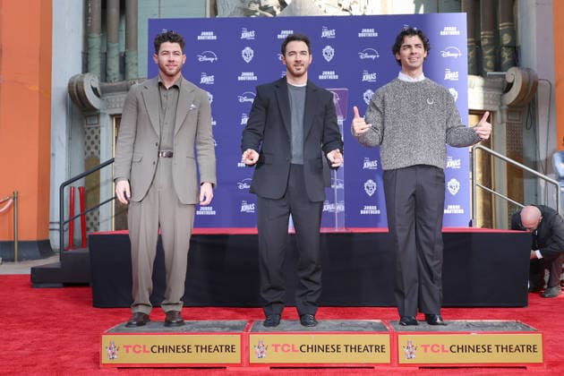 December 3, 2025, Los Angeles, California, USA: Nick Jonas, Kevin Jonas, Joe Jonas at a ceremony honoring the Jonas Brothers with hand and foot prints at the TCL Chinese Theatre IMAX. Los Angeles USA - ZUMAg107 20251203_zep_g107_020 Copyright: xNinaxPrommerx