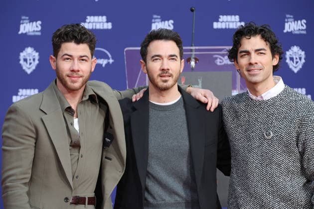 December 3, 2025, Los Angeles, California, USA: Nick Jonas, Kevin Jonas, Joe Jonas at a ceremony honoring the Jonas Brothers with hand and foot prints at the TCL Chinese Theatre IMAX. Los Angeles USA - ZUMAg107 20251203_zep_g107_024 Copyright: xNinaxPrommerx