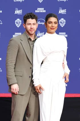 December 3, 2025, Los Angeles, California, USA: Nick Jonas, Priyanka Chopra Jonas at a ceremony honoring the Jonas Brothers with hand and foot prints at the TCL Chinese Theatre IMAX. Los Angeles USA - ZUMAg107 20251203_zep_g107_027 Copyright: xNinaxPrommerx