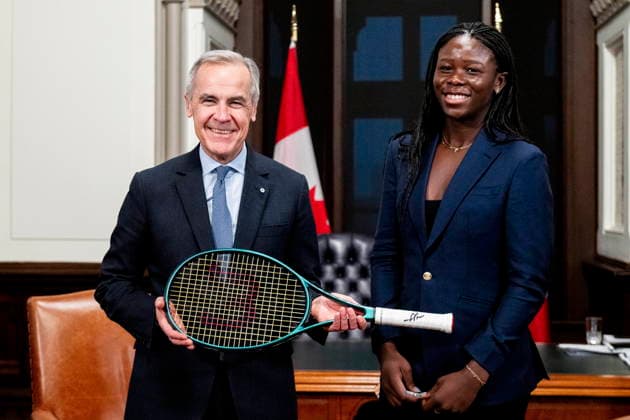 December 3, 2025, Ottawa, On, Canada: Prime Minister Mark Carney, left, and Canadian tennis champion Victoria Mboko are pictured as Carney holds MbokoöÄÃ s tennis racket used to win the 2025 National Bank Open in Montreal during a meeting on Parliament Hill in Ottawa, on Wednesday, Dec. 3, 2025. Ottawa Canada  - ZUMAc35_ 20251203_zaf_c35_102 Copyright: xSpencerxColbyx