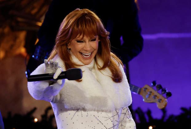 Reba McEntire performs at the 93rd annual Rockefeller Center Christmas Tree lighting ceremony takes place in New York City on Wednesday, December 3, 2025. The 75-foot-tall Norway Spruce came from a home in East Greenbush, New York.  NYP20251203108 JOHNxANGELILLO