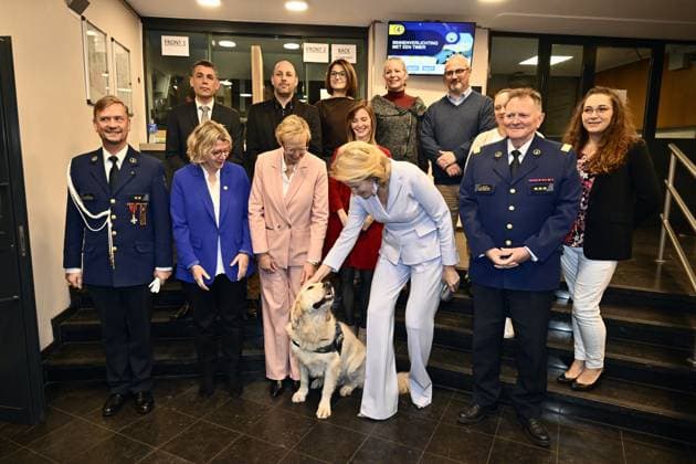 Queen Mathilde of Belgium (C) poses for a family photo during a royal visit to the Emergency Victim Assistance (EVA) unit of the Brussels Capital Ixelles police zone, Thursday 04 December 2025. The visit follows the round table discussion on domestic violence held at the Royal Palace on 4 November.  ERICxLALMAND 146407414