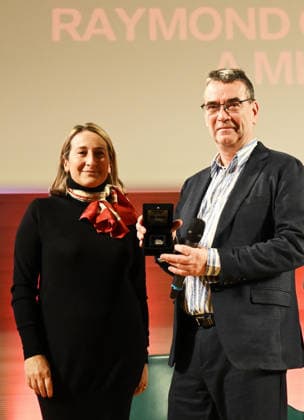 Milan, Italy Mick Herron receives the Raymond Chandler Award at the Noir in Festival with a masterclass at IULM In the photo: Mick Herron receives the Raymond Chandler Award at the Noir in Festival from Valentina Garavaglia, Rector of IULM University  Copyright: xNickxZonnax xipa-agency.netx xNickxZonnax IPA_Agency_IPA68737794