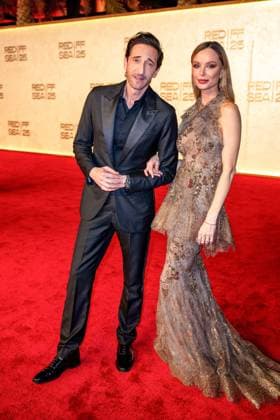 Red Sea Film Festival Opening Ceremony - Jeddah Adrien Brody and Georgina Chapman walk the red carpet as they arrive to the opening ceremony of the 5th edition of the Red Sea Film Festival in Jeddah, Saudi Arabia, on December 4, 2025. Photo by Balkis Press ABACAPRESS.COM Jeddah Saudi Arabia  Copyright: xBalkisxPress ABACAx