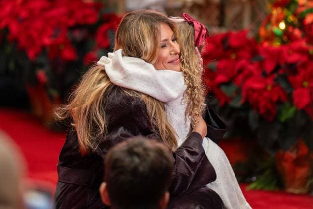 December 5, 2025, Washington, District Of Columbia, USA: First Lady MELANIA TRUMP gives a little girl a big hug after she ran up to embrace her during her visit to the ChildrenÃ¢â‚¬â ¢s National Hospital. Washington USA - ZUMAs365 20251205_znp_s365_011 Copyright: xJoeyxSussmanx