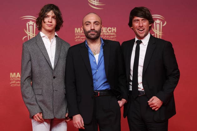 L R Paul Kircher, Pierre Ange Carlotti and Hugo Selignac attend the red carpet during day Eight of the 22nd Marrakech International Film Festival Marrakech, Morocco 05 12 2025 451297 2025 12 05 MARRAKECH Morocco  Copyright: xRomualdxMeigneuxx xStarfacex STAR_451297_086