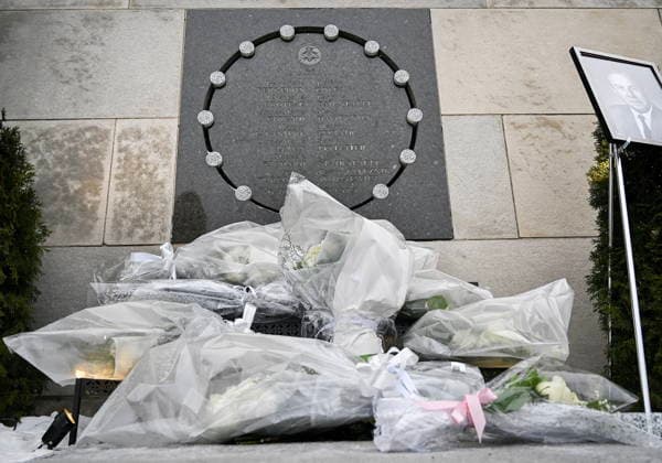 December 6, 2025, Montreal, Pq, Canada: A photograph of Louis Courville, who died recently, and was former President of Ecole Polytechnique, is shown next to bunches of white roses during a memorial for the victims of the 1989 Ecole Polytechnique massacre in Montreal, Saturday, December 6, 2025. Today marks the 36th anniversary of the shooting by an anti-feminist which left 14 women dead and 13 others injured. Montreal Canada - ZUMAc35_ 20251206_zaf_c35_005 Copyright: xGrahamxHughesx