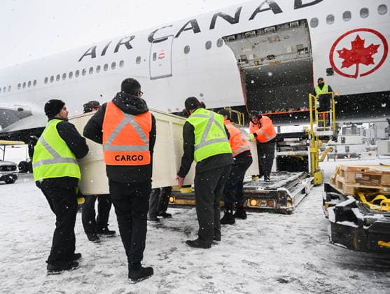 December 6, 2025, Montreal, Pq, Canada: Ground crew unload a kayak and other indigenous artifacts at Trudeau Airport in Montreal, Saturday, December 6, 2025, after they were returned by the Vatican. Montreal Canada  - ZUMAc35_ 20251206_zaf_c35_025 Copyright: xGrahamxHughesx