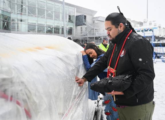 December 6, 2025, Montreal, Pq, Canada: Katisha Paul of the Lil wat and Tsartlip Nations, left, and Peyal Laceese of the Tsilhqot in nation touch a crate containing indigenous artifacts and cultural items at Trudeau Airport in Montreal, Saturday, December 6, 2025, after they were returned by the Vatican. Montreal Canada - ZUMAc35_ 20251206_zaf_c35_026 Copyright: xGrahamxHughesx