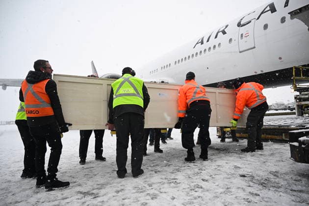 December 6, 2025, Montreal, Pq, Canada: Ground crew unload a kayak and other indigenous artifacts at Trudeau Airport in Montreal, Saturday, December 6, 2025, after they were returned by the Vatican. Montreal Canada  - ZUMAc35_ 20251206_zaf_c35_027 Copyright: xGrahamxHughesx