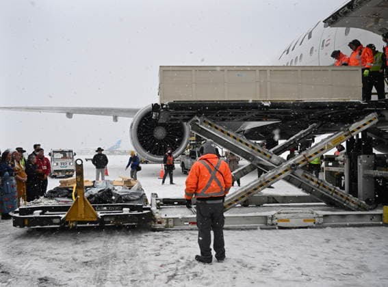 December 6, 2025, Montreal, Pq, Canada: Ground crew unload a kayak and other indigenous artifacts at Trudeau Airport in Montreal, Saturday, December 6, 2025, after they were returned by the Vatican. Montreal Canada  - ZUMAc35_ 20251206_zaf_c35_043 Copyright: xGrahamxHughesx