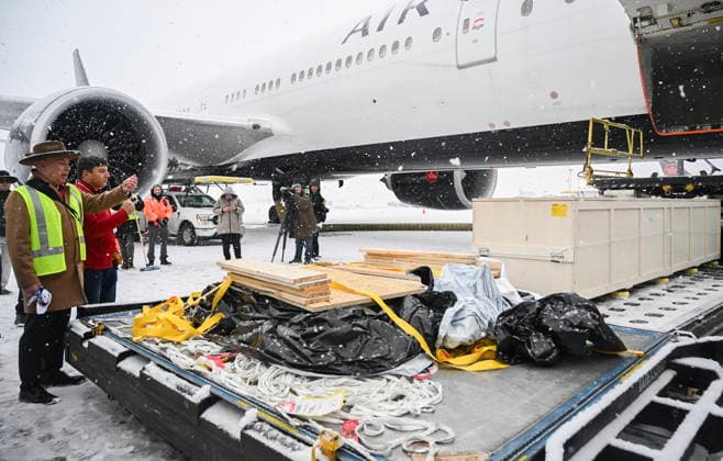 December 6, 2025, Montreal, Pq, Canada: Representatives from various First Nations look on as a kayak and other indigenous artifacts arrive at Trudeau Airport in Montreal, Saturday, December 6, 2025, after they were returned by the Vatican. Montreal Canada  - ZUMAc35_ 20251206_zaf_c35_046 Copyright: xGrahamxHughesx