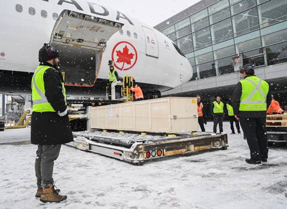 December 6, 2025, Montreal, Pq, Canada: Ground crew unload a kayak and other indigenous artifacts at Trudeau Airport in Montreal, Saturday, December 6, 2025, after they were returned by the Vatican. Montreal Canada  - ZUMAc35_ 20251206_zaf_c35_052 Copyright: xGrahamxHughesx