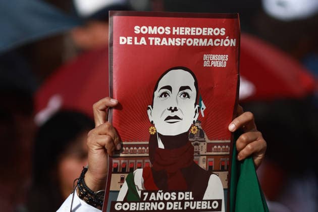 Mexican President Claudia Sheinbaum leads Seven years of transformation in Mexico City MEXICO CITY, MEXICO - DECEMBER 06: A supporter holds a banner during the massive rally named Seven years of transformation at the Zocalo main square, in Mexico City, Mexico on December 06, 2025. The event which drew hundreds of thousands of people was held to celebrate seven years of MORENA party in power. Daniel Cardenas Anadolu Mexico City Mexico. Editorial use only. Please get in touch for any other usage.  Copyright: x2025xAnadoluxDanielxCardenasx