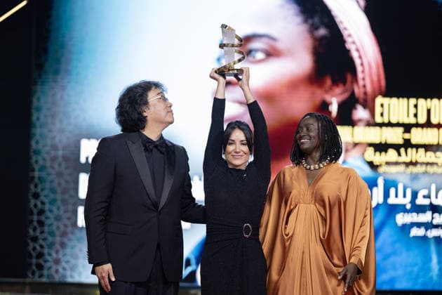 22nd International Marrakech Film Festival MARRAKECH, MOROCCO – DECEMBER 6: French-Tunisian director Erige Sehiri (C) and French actress of Senegalese origin Aissa Maiga (R) receive their Etoile d Or Award for the film Promised Sky from jury president, South Korean director Bong Joon-ho (L), during the 22nd International Marrakech Film Festival awards ceremony on December 6, 2025, in Marrakech, Morocco. Abu Adem Muhammed Anadolu Marrakech Morocco. Editorial use only. Please get in touch for any other usage.  Copyright: x2025xAnadoluxAbuxAdemxMuhammedx
