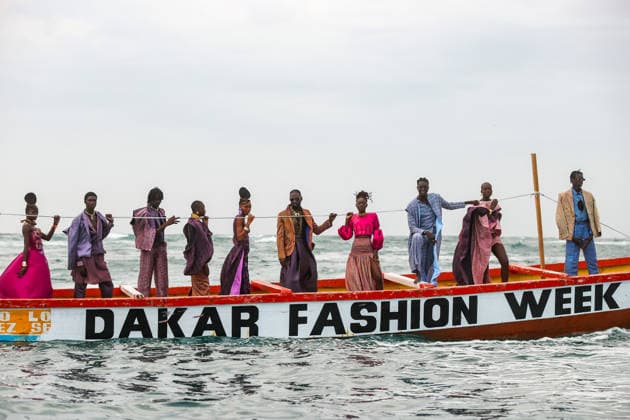 23rd Dakar Fashion Week held on fishing boats DAKAR, SENEGAL – DECEMBER 6: Models showcase designs aboard fishing boats off Ngor Island during the 23rd Dakar Fashion Week, organized by Senegalese-French designer Adama N’Diaye, founder of the brand Adama Paris, on December 6, 2025, in Dakar, Senegal. Cem Ozdel Anadolu Dakar Senegal. Editorial use only. Please get in touch for any other usage.  Copyright: x2025xAnadoluxCemxOzdelx