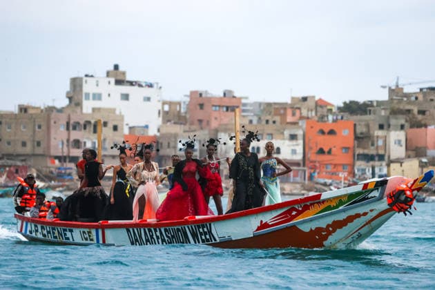 23rd Dakar Fashion Week held on fishing boats DAKAR, SENEGAL – DECEMBER 6: Models showcase designs aboard fishing boats off Ngor Island during the 23rd Dakar Fashion Week, organized by Senegalese-French designer Adama N’Diaye, founder of the brand Adama Paris, on December 6, 2025, in Dakar, Senegal. Cem Ozdel Anadolu Dakar Senegal. Editorial use only. Please get in touch for any other usage.  Copyright: x2025xAnadoluxCemxOzdelx