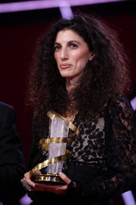 Jihan Kikhia poses on stage after receiving the Jury Prize for the film My Father and Qaddafi during the Closing Ceremony during the 22nd Marrakech International Film Festival Marrakech, Morocco 06 12 2025 451320 2025 12 06 MARRAKECH Morocco  Copyright: xRomualdxMeigneuxx xStarfacex STAR_451320_087