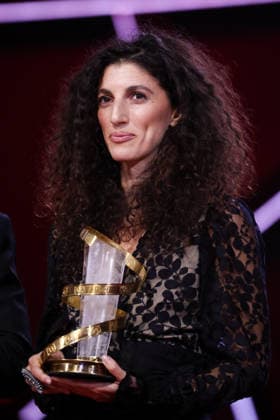 Jihan Kikhia poses on stage after receiving the Jury Prize for the film My Father and Qaddafi during the Closing Ceremony during the 22nd Marrakech International Film Festival Marrakech, Morocco 06 12 2025 451320 2025 12 06 MARRAKECH Morocco  Copyright: xRomualdxMeigneuxx xStarfacex STAR_451320_089