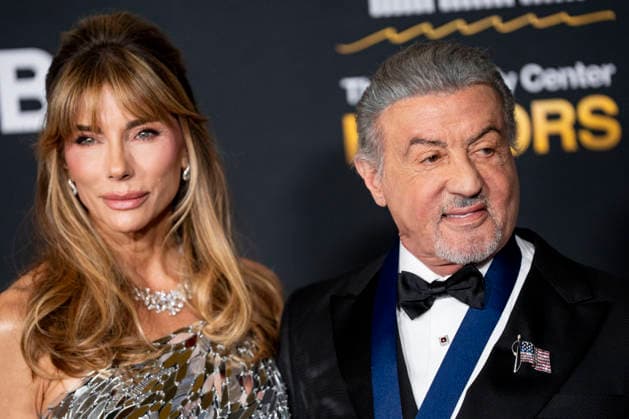 Kennedy Center Honoree Actor and Producer Sylvester Stallone and his wife, Jennifer Flavin Stallone, arrive on the red carpet for the 48th annual Kennedy Center Honors at the Kennedy Center in Washington DC on Sunday, December 7, 2025. President Donald Trump will host this year s event, which honors songwriter George Strait, actors Michael Crawford and Sylvester Stallone, singer Gloria Gaynor, and the rock band Kiss.  WAP20251207552 BONNIExCASH