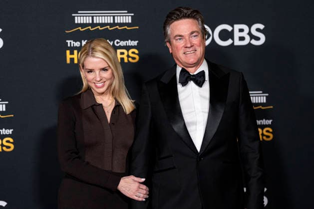 Attorney General Pam Bondi and John Wakefield arrive on the red carpet for the 48th annual Kennedy Center Honors at the Kennedy Center in Washington DC on Sunday, December 7, 2025. President Donald Trump will host this year s event, which honors songwriter George Strait, actors Michael Crawford and Sylvester Stallone, singer Gloria Gaynor, and the rock band Kiss.  WAP20251207575 BONNIExCASH