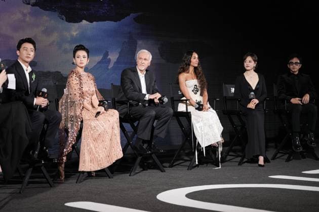 SANYA, CHINA - DECEMBER 08: (L-R) Actor Huang Xuan, actress Zhang Ziyi, director James Cameron, American actress Zoe Saldana, actress Susan Sun Li and actor Deng Chao attend the China premiere of film Avatar: Fire and Ash on December 8, 2025 in Sanya, Hainan Province of China.  Copyright: xVCGx 111608432989