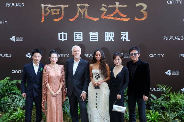 SANYA, CHINA - DECEMBER 08: (L-R) Actor Huang Xuan, actress Zhang Ziyi, director James Cameron, American actress Zoe Saldana, actress Susan Sun Li and actor Deng Chao attend the China premiere of film Avatar: Fire and Ash on December 8, 2025 in Sanya, Hainan Province of China.  Copyright: xChinaxNewsxServicex 111608442418