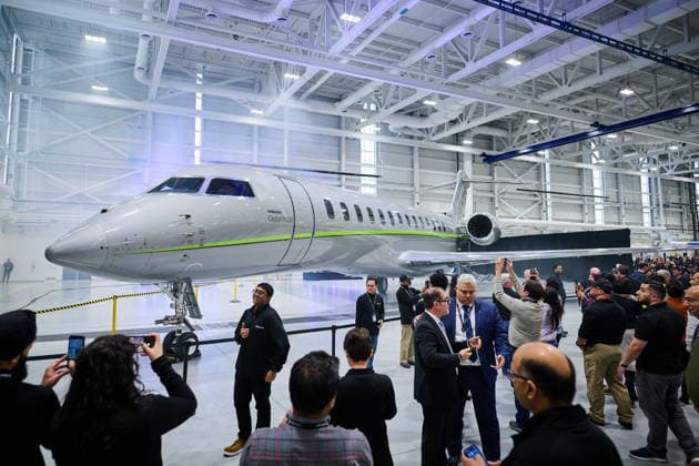 December 8, 2025, Mississauga, On, Canada: Workers and media take pictures as the new Bombardier Global 8000 high-speed business jet is presented at an event celebrating its entry-into-service at the company s aircraft assembly centre in Mississauga, Ont., on Monday, Dec. 8, 2025. Mississauga Canada  - ZUMAc35_ 20251208_zaf_c35_092 Copyright: xSammyxKoganx