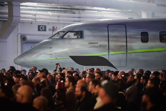 December 8, 2025, Mississauga, On, Canada: Workers and media look on during an event celebrating Bombardier s Global 8000 aircraft entry-into-service at the company s aircraft assembly centre in Mississauga, Ont., on Monday, Dec. 8, 2025. Mississauga Canada  - ZUMAc35_ 20251208_zaf_c35_098 Copyright: xSammyxKoganx